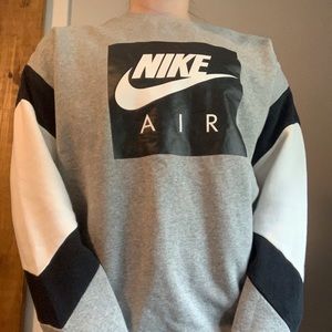 Black, gray, and white Nike air crew neck